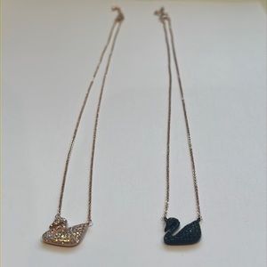 Two Swans necklaces, one is black one is rose gold color.  Selling both together
